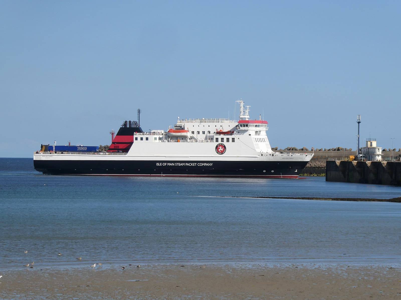 The Steam Packet ferry Ben-my-Chree sailing into Douglas harbour across calm blue water.