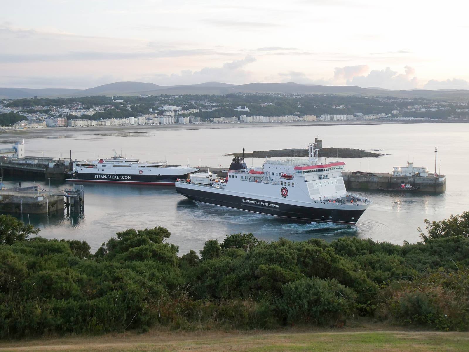 The Steam Packet ferries Ben-my-Chree and Manannan in Douglas harbour, with the town and the bay behind.