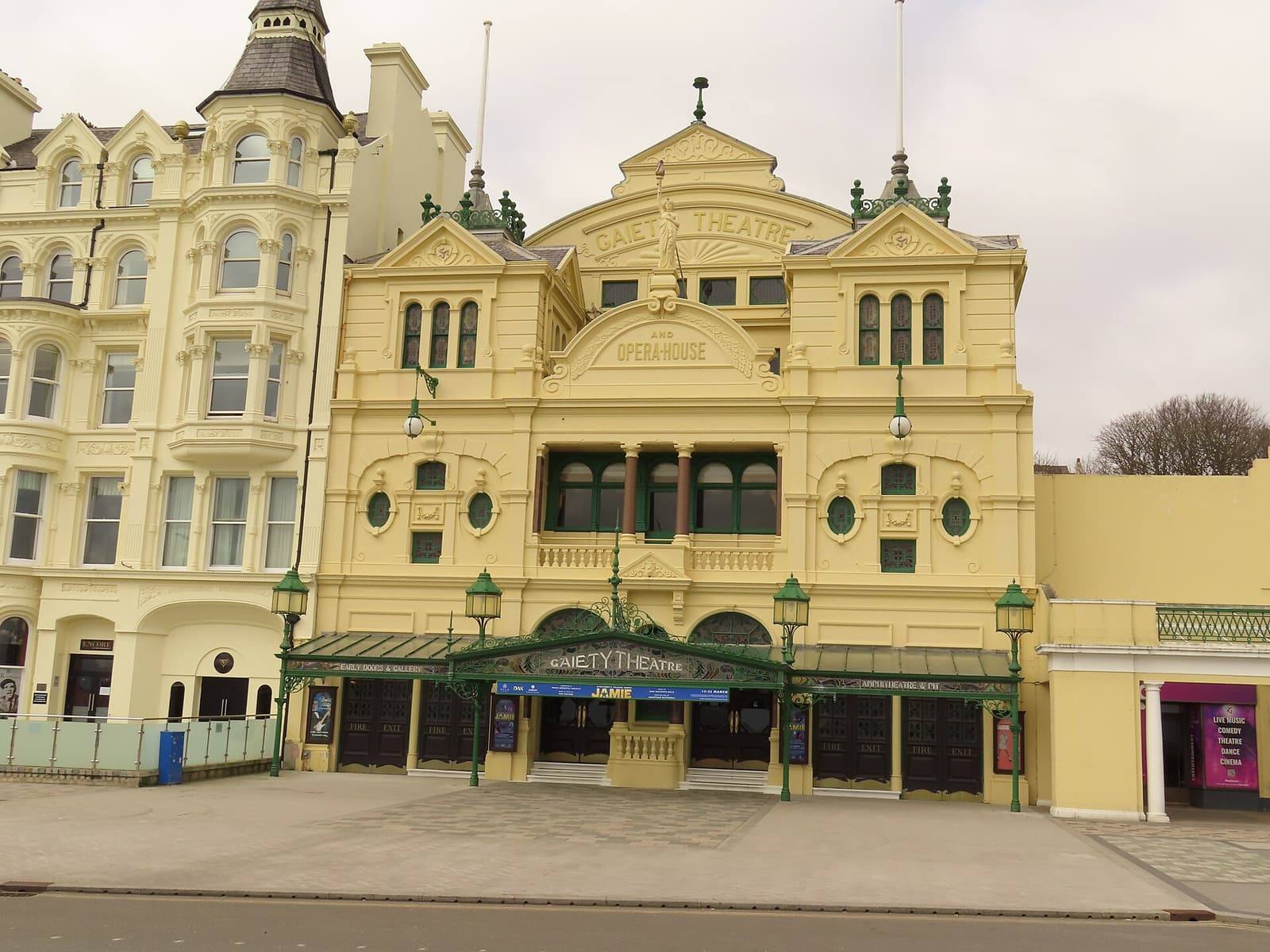 The ornate cream and yellow Victorian front of the Gaiety Theatre and Opera House in Douglas.