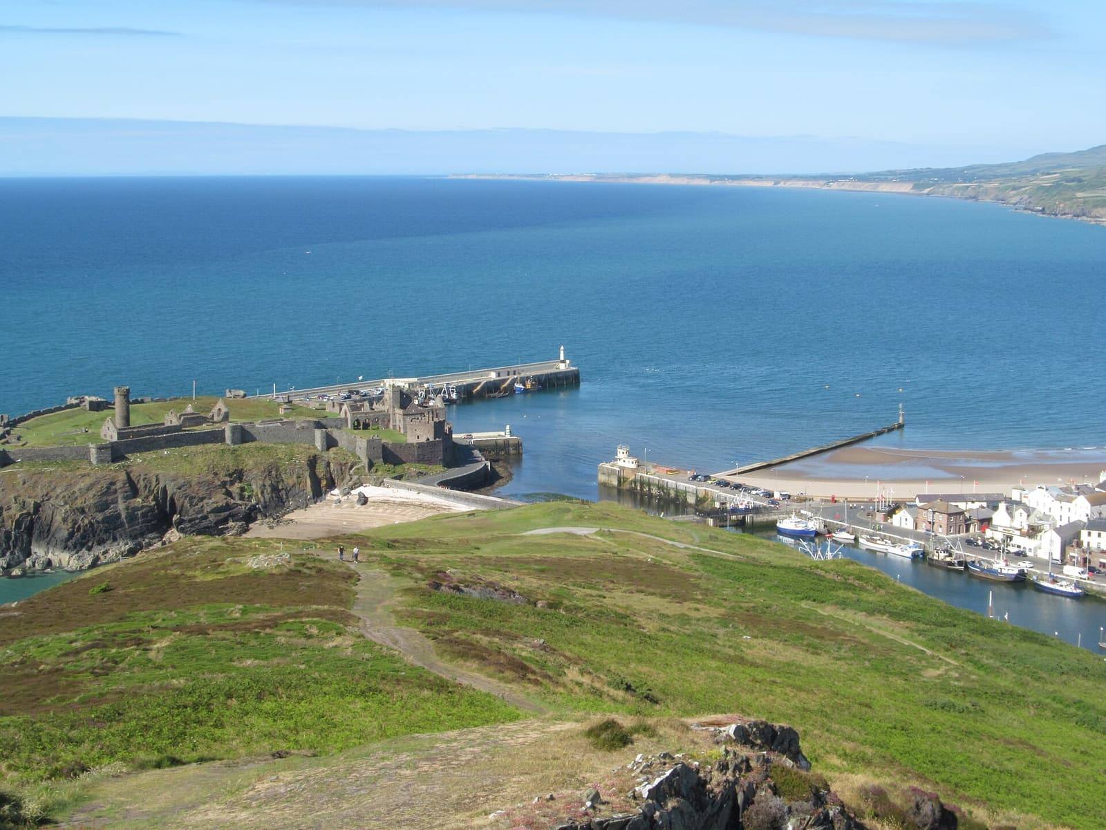 Looking north from Peel Hill over St Patrick's Isle, the harbour breakwater and the long west coast.